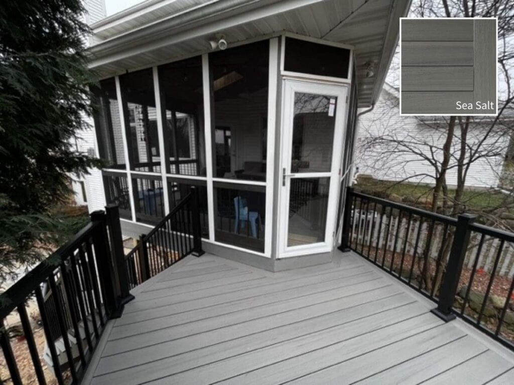 Screen porch & deck combination built with TimberTech Sea Salt Gray decking and black railings.