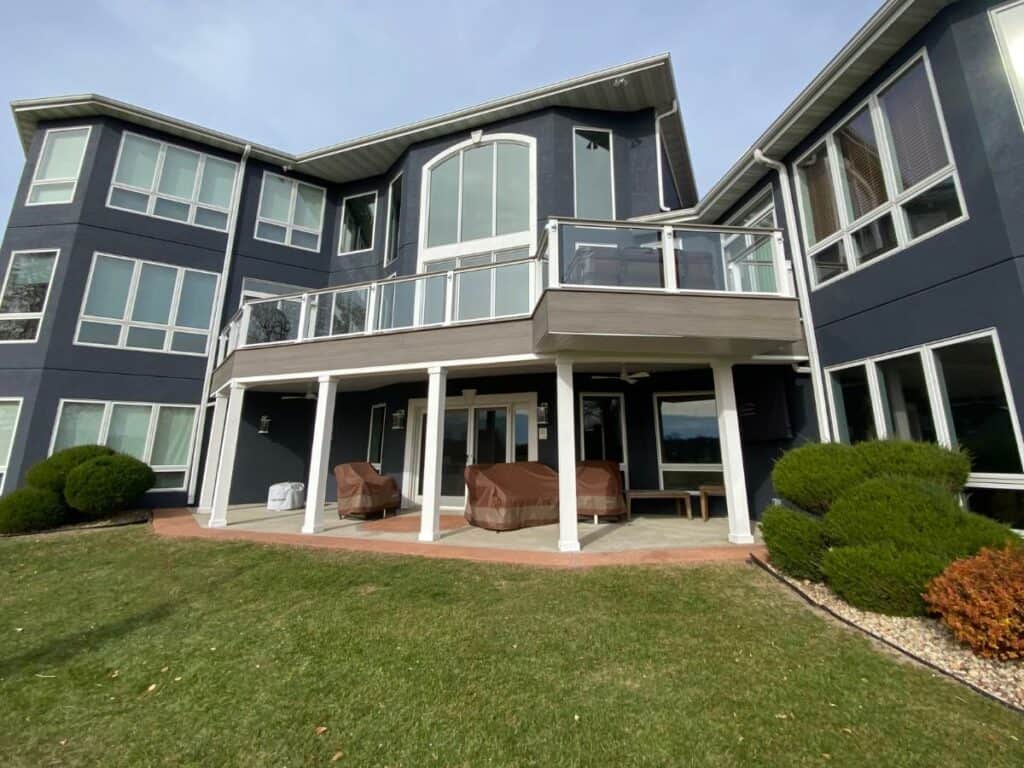 Deck with patio below protected by Trex RainEscape system.